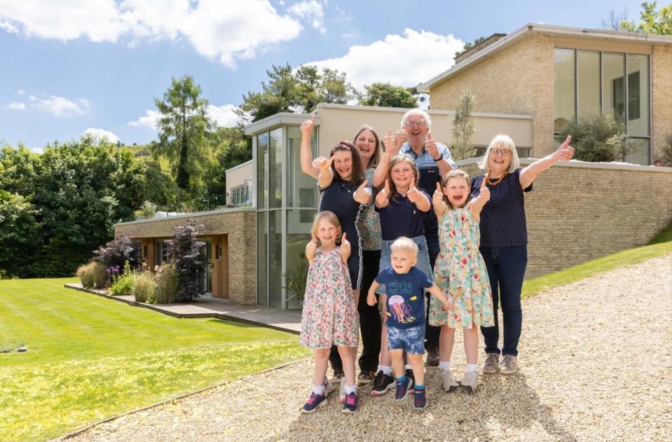 The Cotswolds which was won by Susan Havenhand (right) in the Omaze Million Pound House Draw, she is pictured with her husband John, daughter Harriet and grandchildren. (PA)