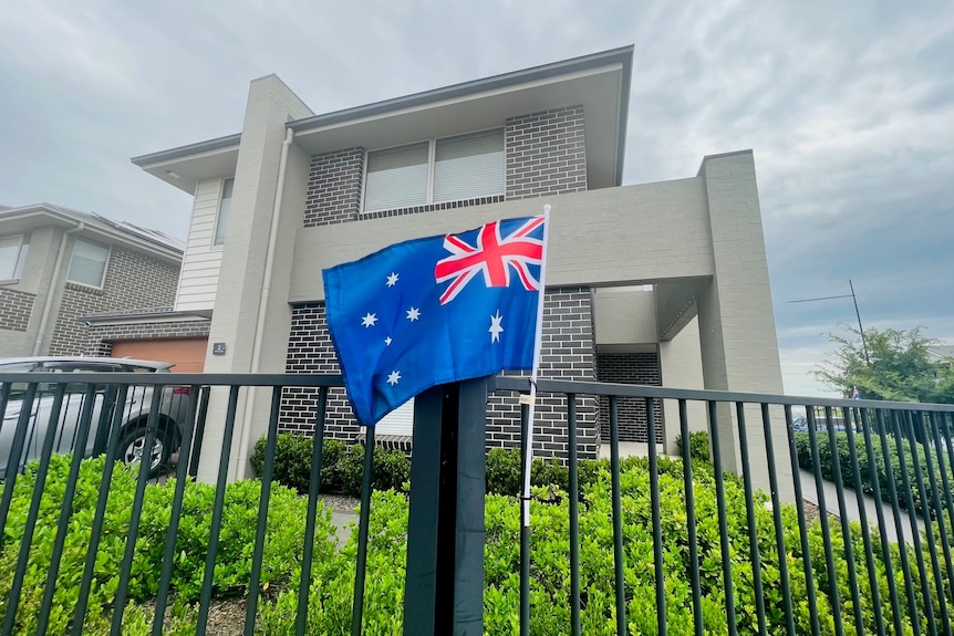 A house with an Australian flag at the front.