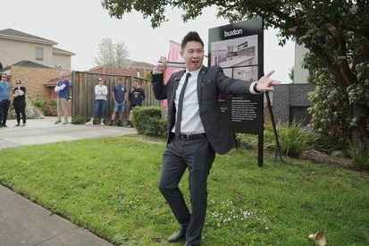 Rowan Liew, associate director and auctioneer at Buxton Box Hill holds an auction in Melbourne.