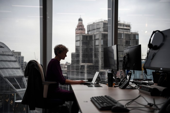 A member of staff poses for a photograph at a workspace in the National Cyber Security Centre  in London, England.