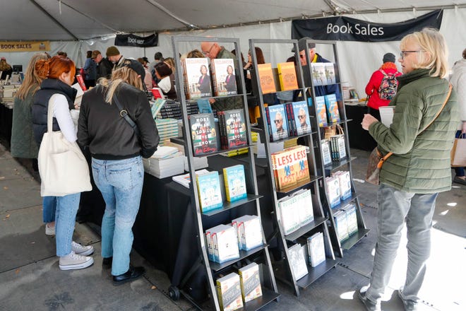 Shelves displayed featured titles by authors who were available for autographs on Saturday February 18, 2023 during the annual Savannah Book Festival in Telfair Square.