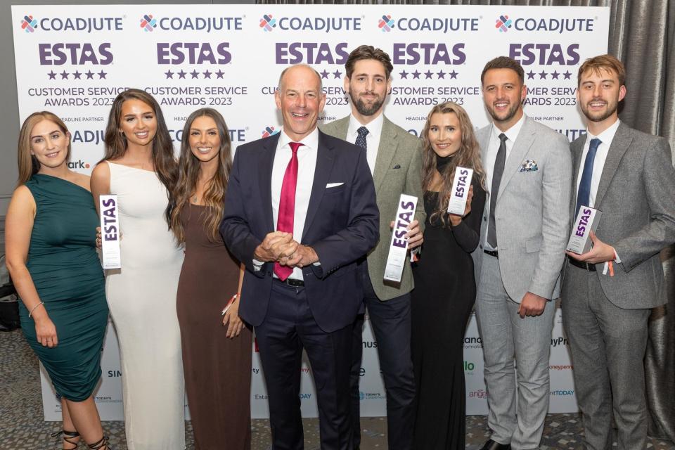 BuckleyBrown staff celebrate securing the top award at the 2023 ESTAs. TV presenter Phil Spencer (with the red tie), Jon Brown next to him, and some of the BuckleyBrown team.