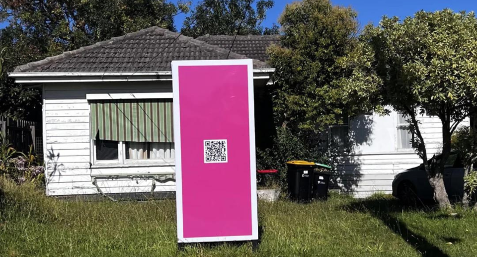Real estate agent sign with QR code for rental property