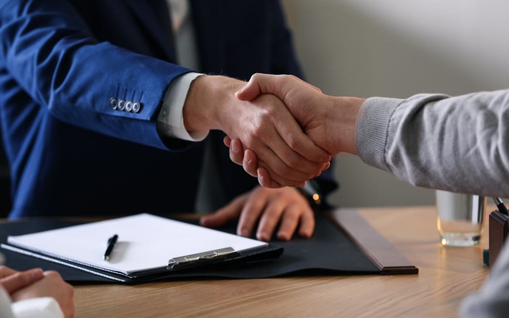 Business deal, men shaking hands