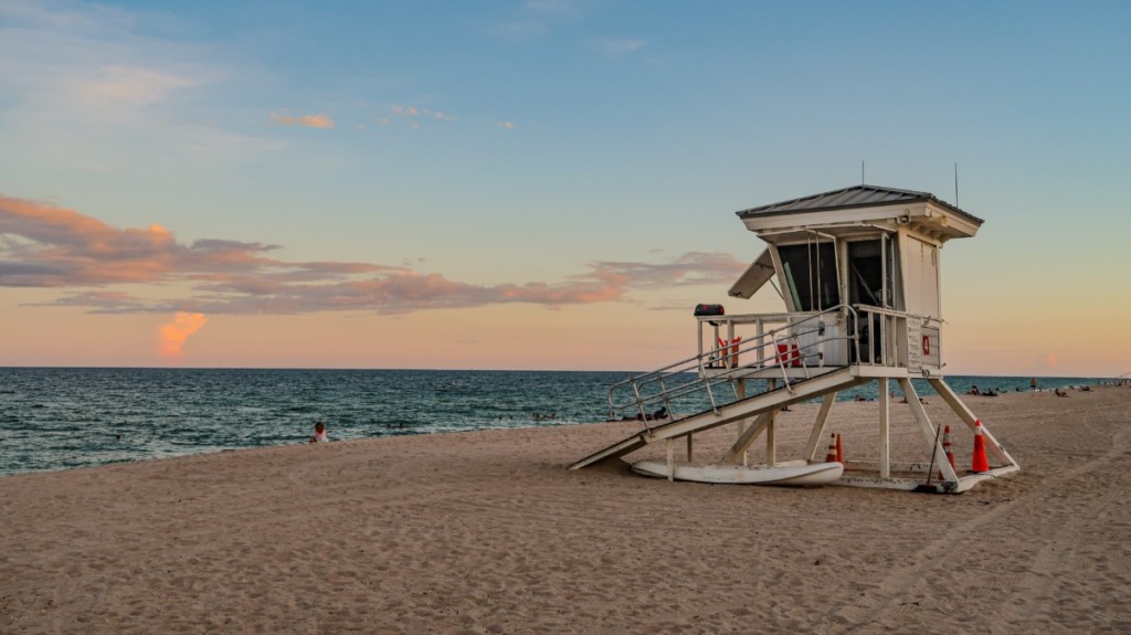 lifeguard post at beach in florida during sunset