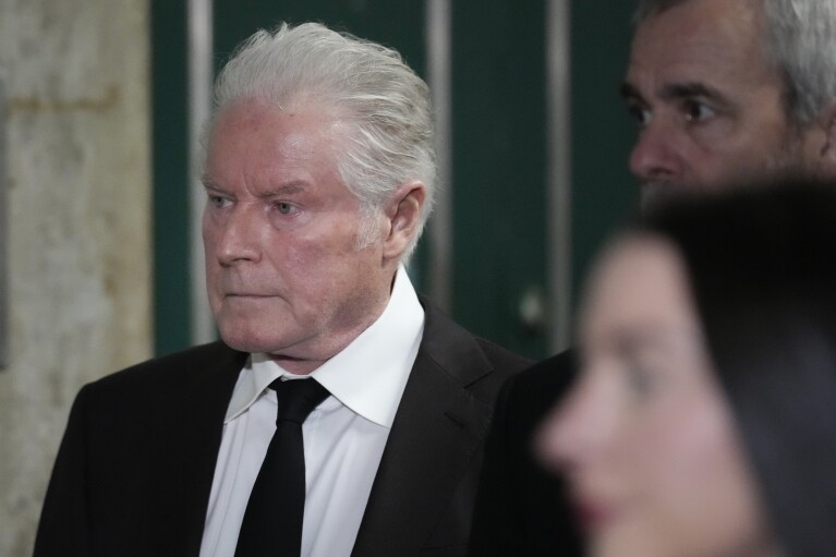 Musician Don Henley returns to court after a break in New York, Tuesday, Feb. 27, 2024. Henley resumed testifying Tuesday in a trial over handwritten drafts of lyrics to some of the Eagles' biggest hits, including “Hotel California," and his decade-long effort to reclaim the pages. (AP Photo/Seth Wenig)