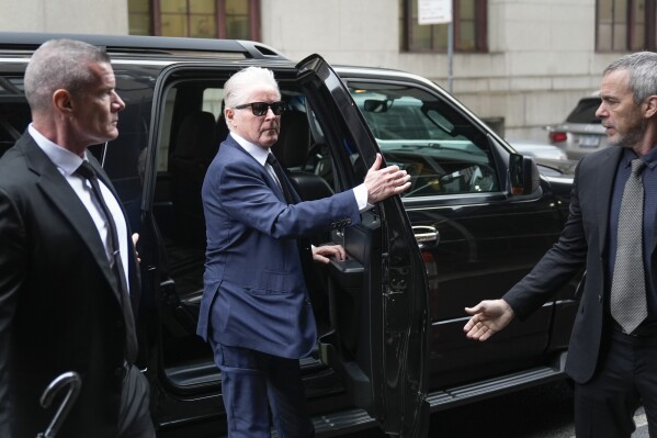 Musician Don Henley, center, arrives to court in New York, Wednesday, Feb. 28, 2024. Three collectibles-world professionals are on trial in the criminal case involving roughly 100 legal-pad sheets from the development of the Eagles’ 1976 “Hotel California” album. They are charged with scheming to conceal the pages' disputed ownership and sell them despite knowing that Henley claimed they had no right to do so.. (AP Photo/Seth Wenig)