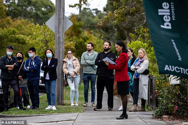 The most aggressive interest rises since 1989 had initially caused property values to fall in 2022 but in 2023, they soared again (pictured is a Melbourne auction)