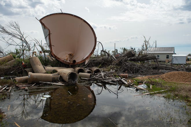 The water tower still sits in the middle of a field one year after an EF-4 tornado brought it down in Rolling Fork, Miss., seen on Wednesday, Mar. 20, 2024.