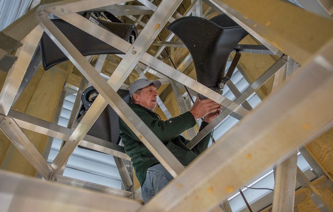 First Baptist Church of Rolling Fork member Roger Jones of Anguilla, Miss., adds speaker mechanisms to the speaker cones inside the new church steeple before it was scheduled to be raised onto the church roof Friday. The EF-4 tornado that ripped through the small Delta town on March 24, 2023, took down the previous steeple. The chimes are scheduled to ring for the first time at 8:03 p.m., Sunday, one year to the minute the tornado hit.