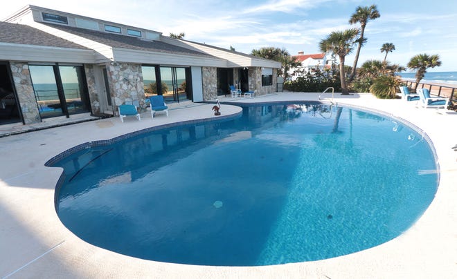 This outdoor pool connects to an indoor pool at the oceanfront mansion of the late Hawaiian Tropic founder Ron Rice on Monday, Nov. 28, 2022. Rice's estate put the luxury home at 175 Ocean Shore Blvd. in Ormond Beach up for sale on Thanksgiving Day 2022.