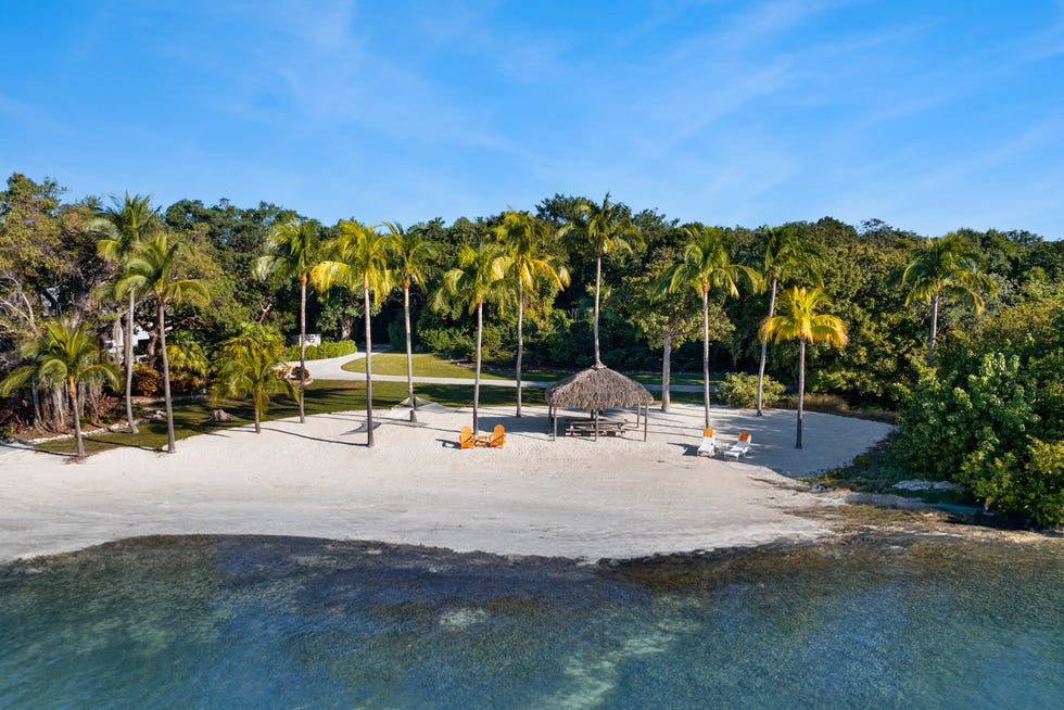 The private beach on Pumpkin Key. The entire private island along with a mainland house in the Key Largo Ocean Reef Club was listed at $75 million on Feb. 13, 2024 by Compass.