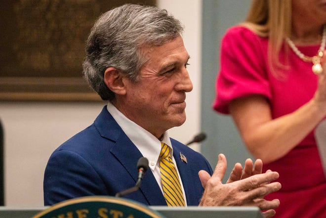 Gov. John Carney claps at the conclusion of his State of the State Address at Legislative Hall in Dover, Tuesday, March 5, 2024. The event was rescheduled from January after Carney fell ill.
