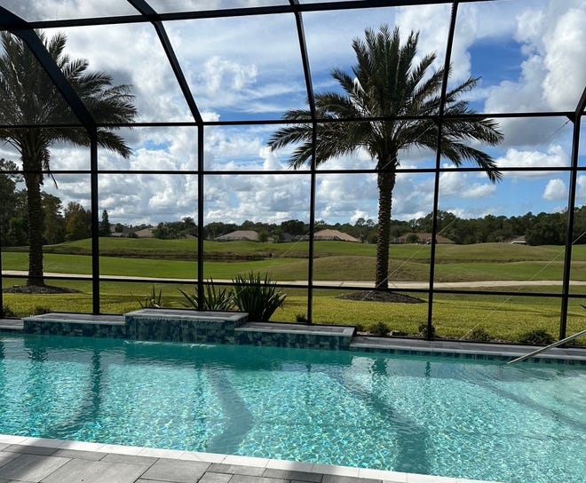 This is a view of the golf course at Plantation Bay from the screen-in pool for the 5-bedroom, 5-bath home at 1000 Sudbury Lane in Ormond Beach that sold on March 15, 2024 for $3 million. The home has 5,835 square feet of living space and includes a 4-car garage. It was built in 2021.