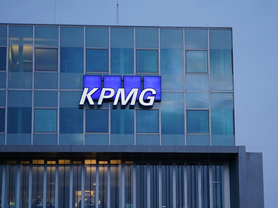 The logo of KPMG, a multinational tax advisory and accounting services company, hangs on the facade of a KPMG offices building on January 22, 2021 in Berlin, Germany.