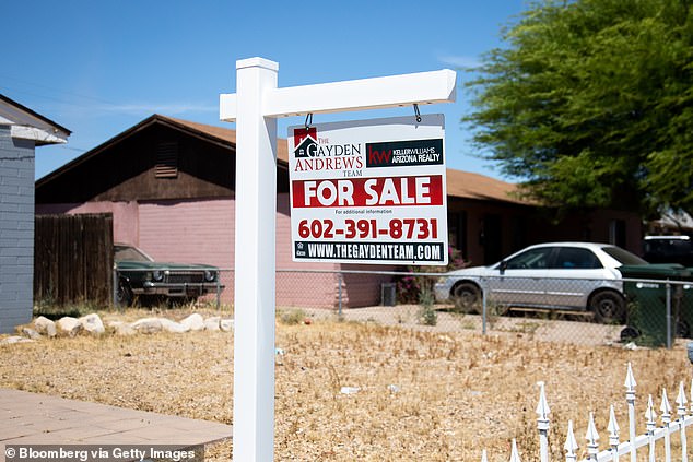 Single women are purchasing an increasing share of homes but Whitney doubts they will be able to absorb all the demand, so prices will fall. Pictured is a 'for sale' sign outside a home in Phoenix, Arizona