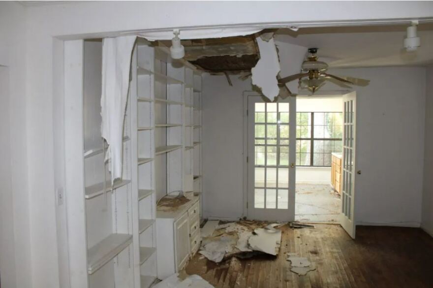 Raised floorboards and ceiling damage greeted visitors to a vacant Carleton Avenue house owned by the city of Fort Worth, on Sept. 20, 2023. Residents say the issues were caused by a broken water heater. Eight homes purchased by the city will be put back on the market this year.