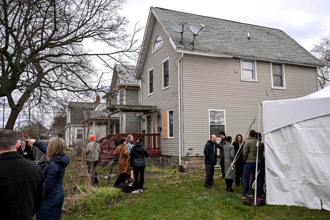 Guests mingle after a press conference announcing Sparrow Health System's donation of home properties to the Ingham County Land Bank and Habitat for Humanity on Wednesday, April 3, 2024, in Lansing. The plan is to renovate and sell the properties as single family housing.
