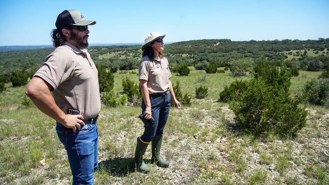 April Rose, Travis County Parks land stewardship manager, and Craig Bowen, senior land stewardship specialist, on Tuesday visit the newly acquired Castletop property. Travis County recently purchased the 475-acre tract property for $40 million with money from the parks bond approved by voters last year.